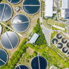 Aerial view of tanks at a large wastewater treatment plant
