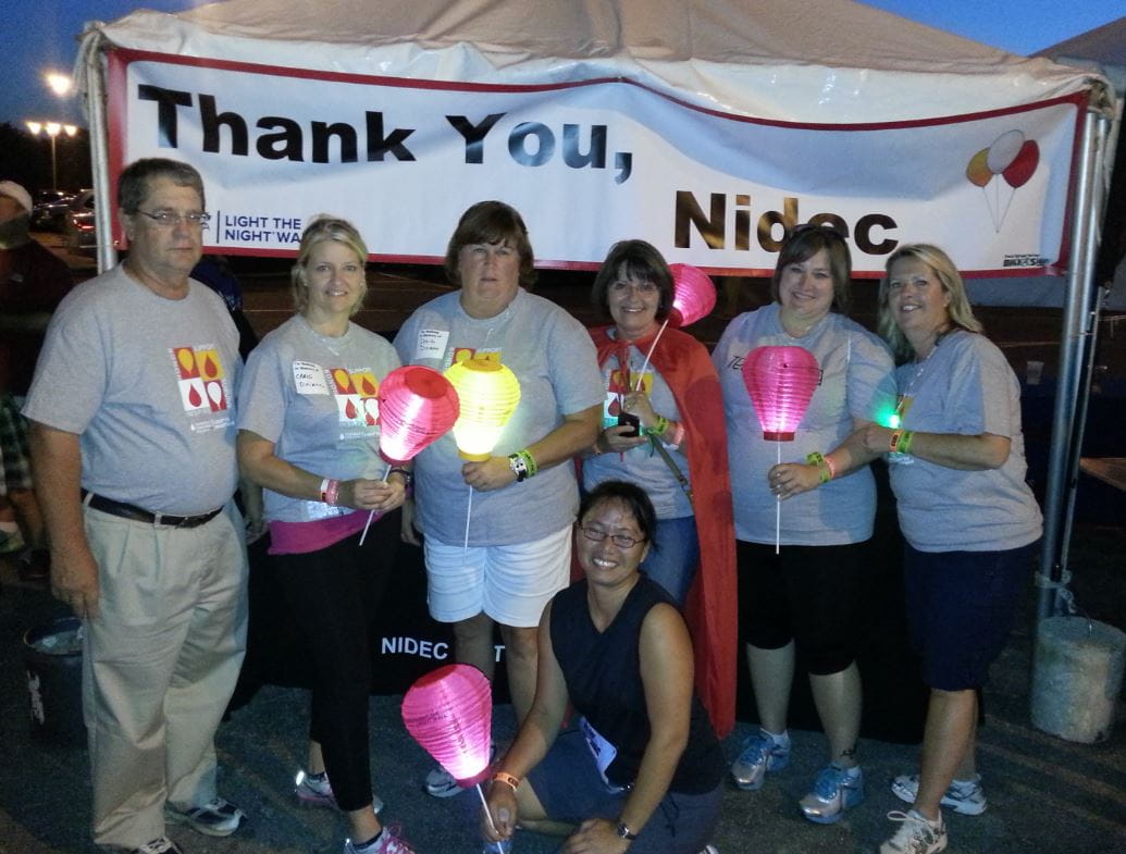 Nidec Motor Corporation employees participate in a Light the Night fundraiser for the Leukemia & Lymphoma Society.