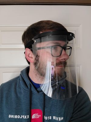Man with face shield