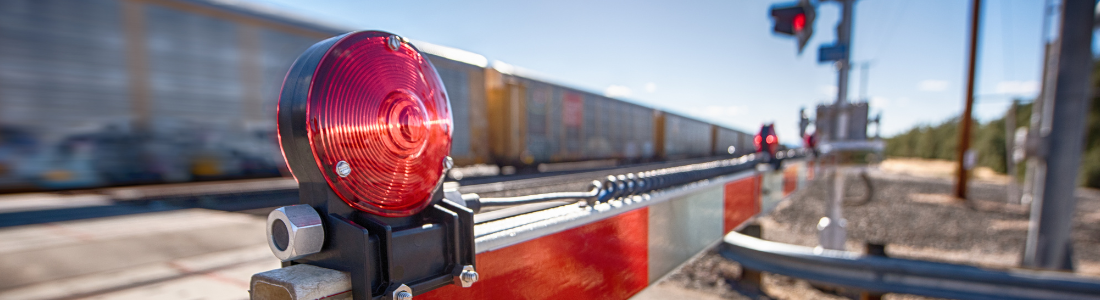 commercial gate motors lifting a railroad crossing stop sign and gate